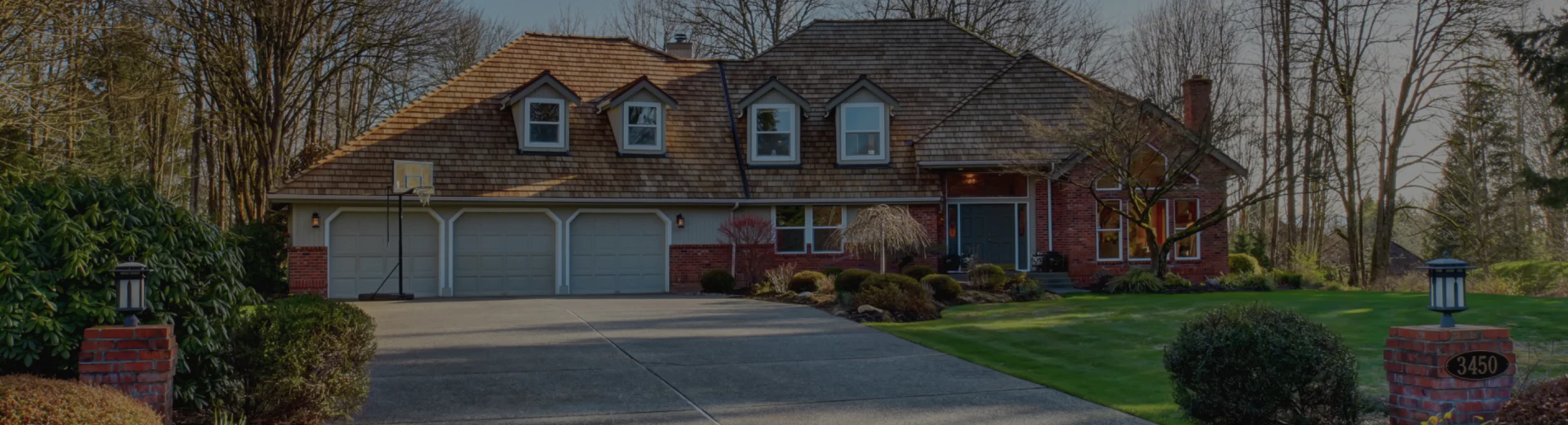 residential house with large concrete driveway